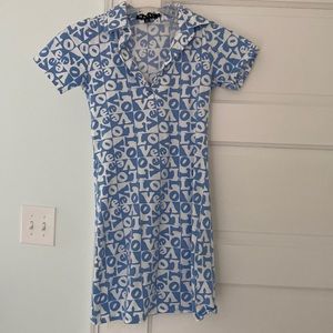 Slim fit, blue and white love dress with cute collar. Row of buttons for style.